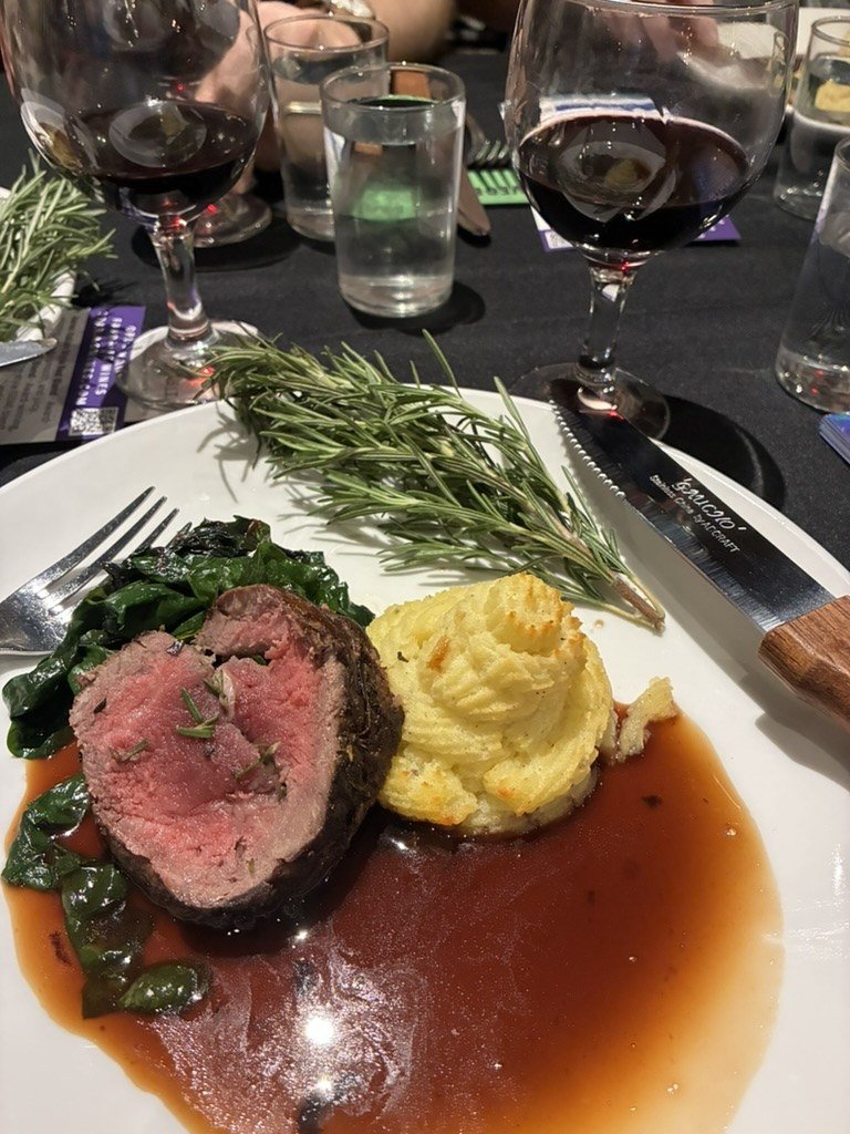 Beef tenderloin with wilted spinach, duchess potatoes and rosemary, paired with a glass of Soaring Wines red