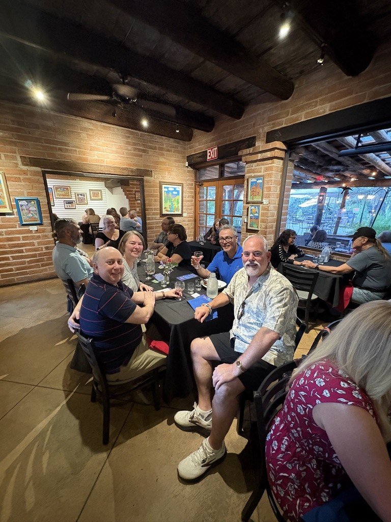 Guests seated at the Soaring Wines pairing dinner in the brick dining room at the Garden Bistro at Tohono Chul, Tucson